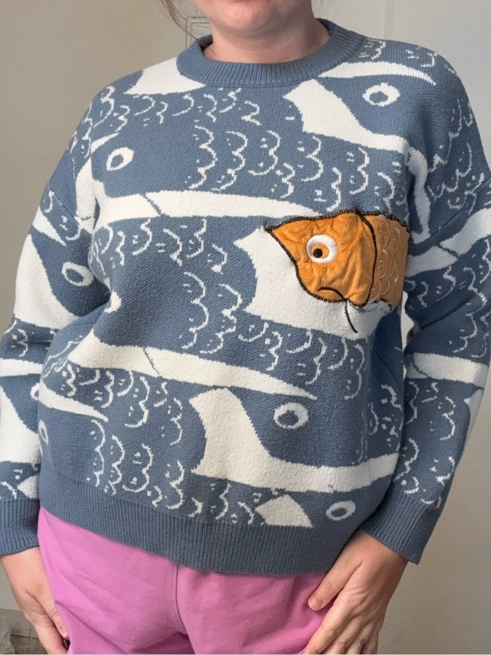 Blue and White Fish Pattern Crewneck Sweater with Orange Fish Accent